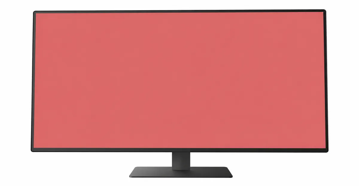Moderner Breitbild-LCD-Computermonitor, der eine gleichmäßige Altrosa-Rotfarbe zeigt, die den gesamten Anzeigebereich von Rand zu Rand ausfüllt, was einen einheitlichen roten Farbstich anzeigt, der den gesamten Bildschirm betrifft